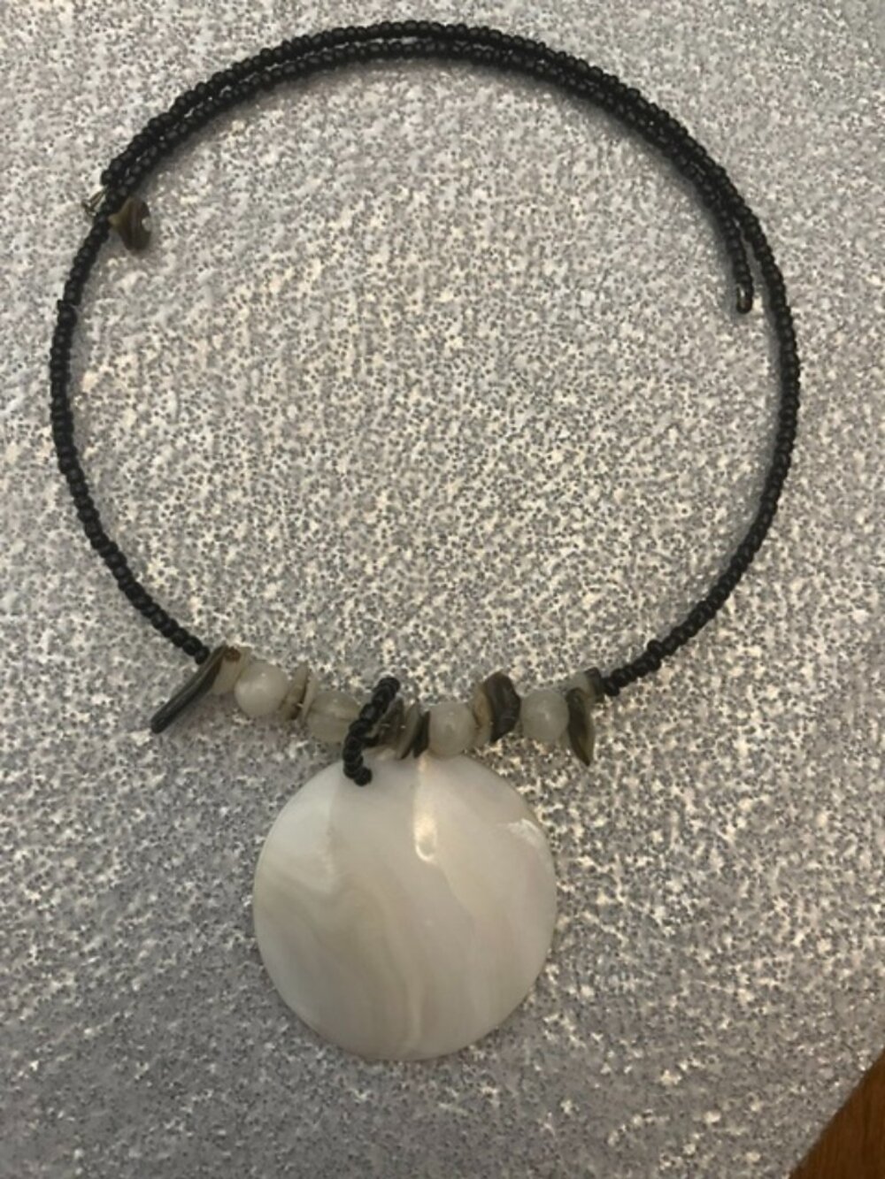 Bohemian style statement chocker with mother of pearl disc pendent